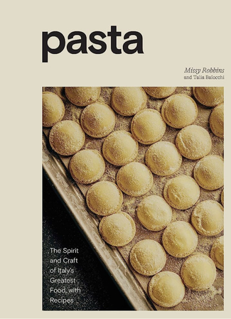 The beige cover of the Pasta book with ravioli photographed on it